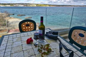 Отель No56 Tower View WATER'S EDGE SEAFRONT LICENSED APARTMENT  Мелиха